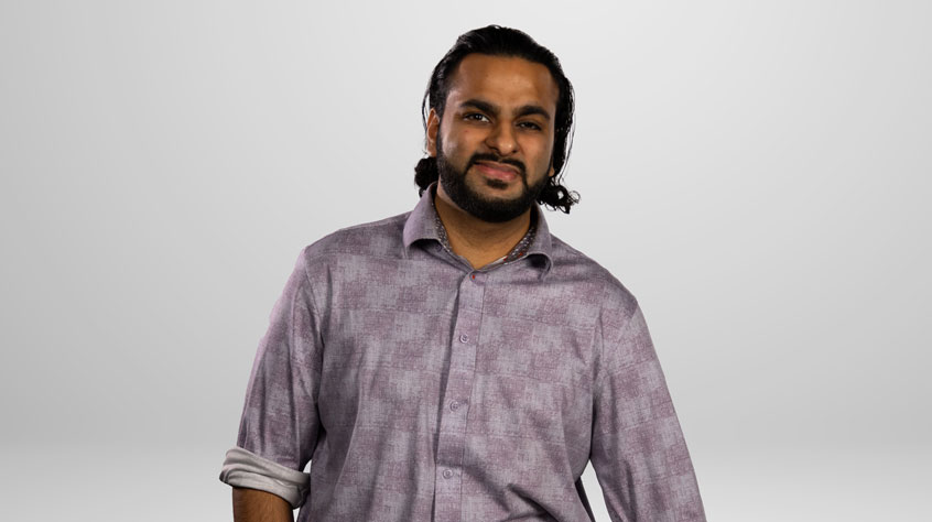 Student Shahzad posing for a photo in a studio