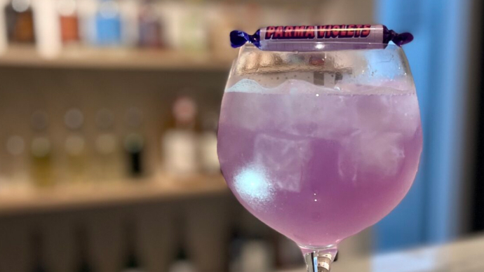Parma Violets cocktail on a bar