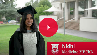 Student talking to camera at graduation
