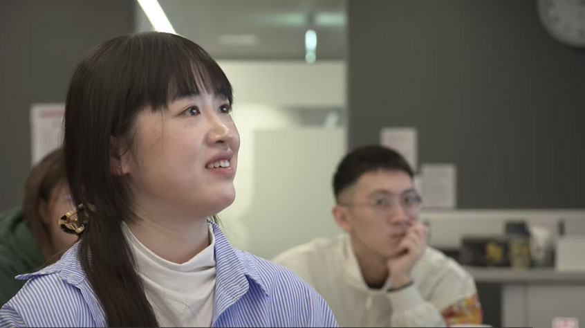 Students sitting in class listening to a lecturer.