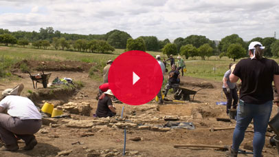 Archaeologists in a field digging