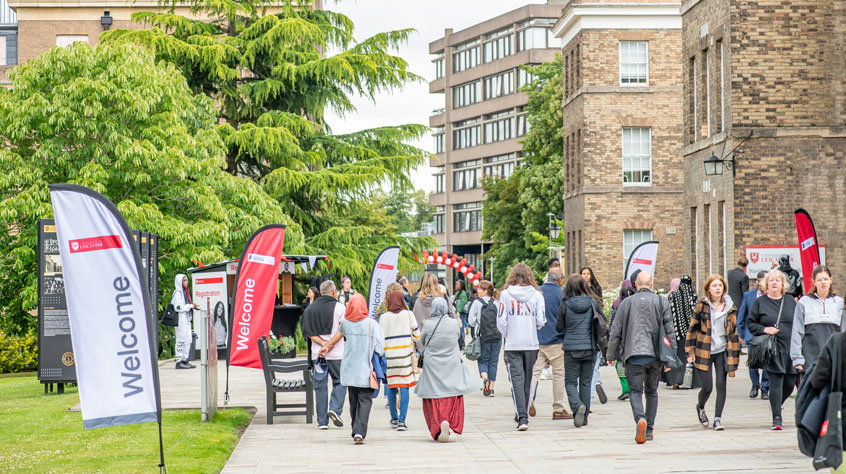 People walking through University of Leicester campus on an Open Day