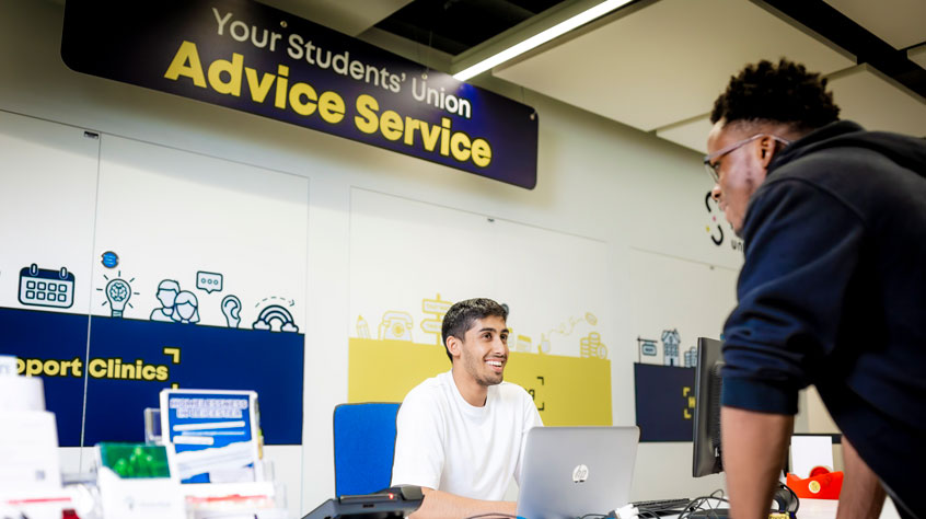 Student talking to a member of staff at the advice service in the Students' Union