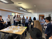 Participants gathered around a table at the Co-Navigator Tool event on 17 October 22