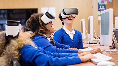 Group of students trying out VR headsets