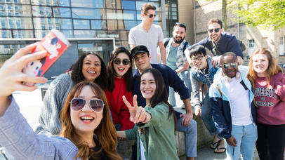 Diverse group of students take a selfie