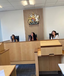 Three students sat in mock court at the University of Leicester
