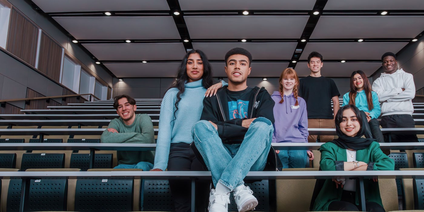 Students posing for a picture in a lecture theatre