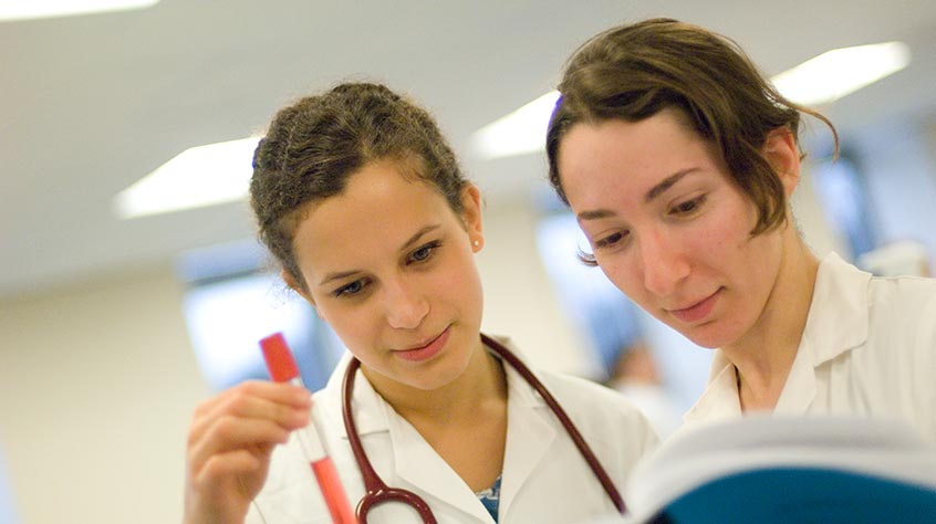 students analysing a test tube