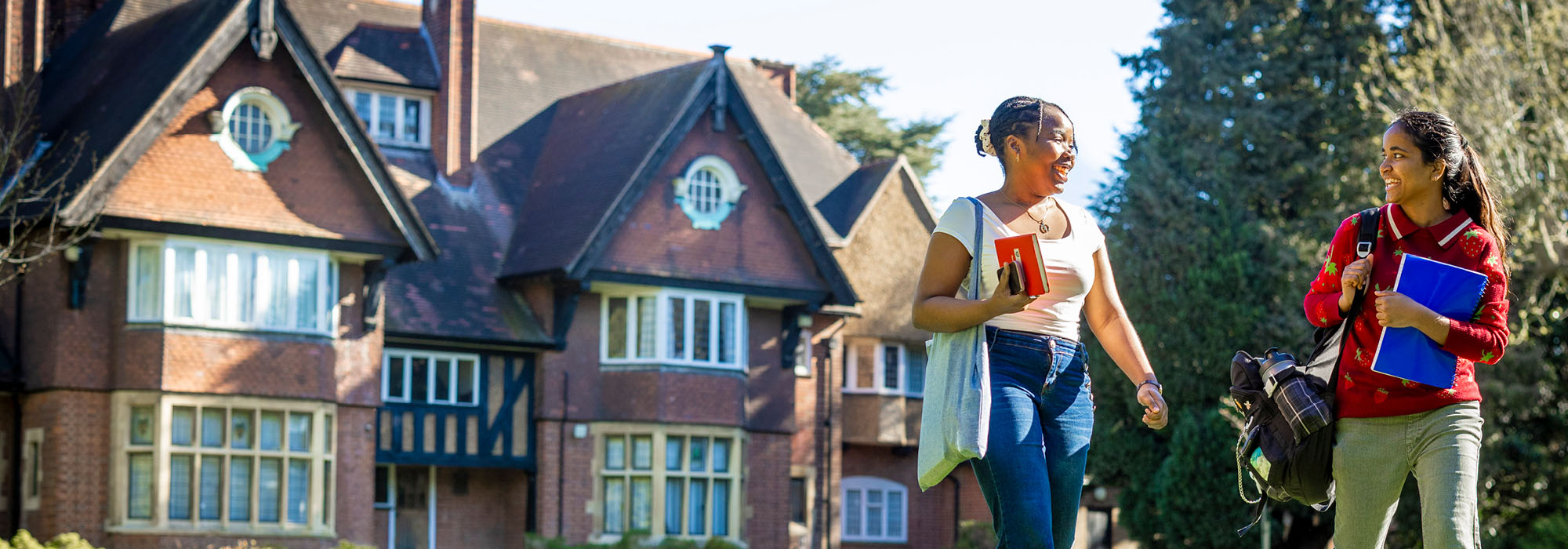 Two students walking at Brookfield in Leicester