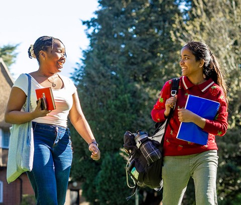Two students walking at Brookfield in Leicester