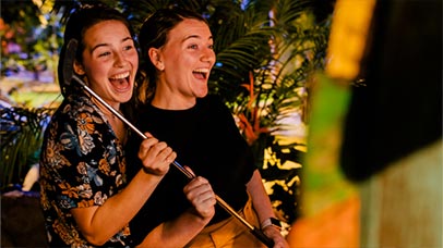 Two students enjoying a round of crazy golf