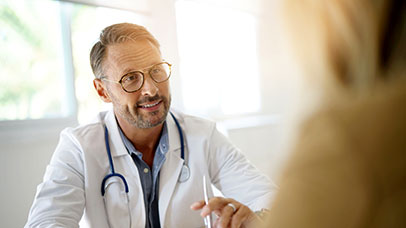 student chatting to doctor