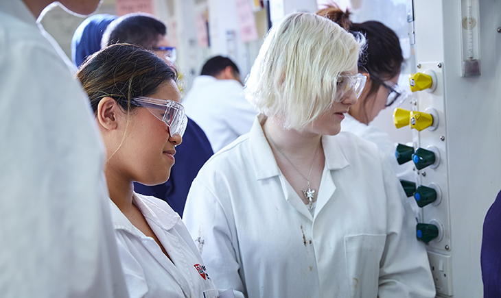 2 students in chemistry lab