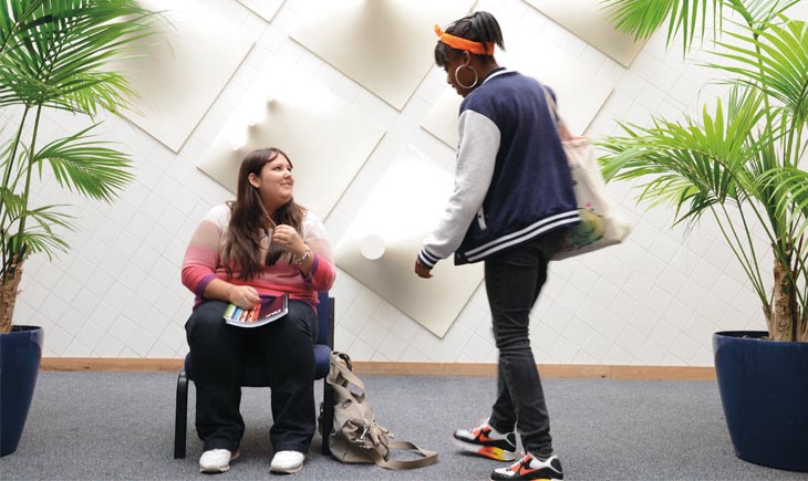 Two students talking in the Attenborough Building